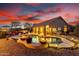 Stunning backyard features a beautiful pool, fire bowls, and an outdoor kitchen and dining area at 28802 N 45Th St, Cave Creek, AZ 85331