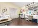 Bright craft room or office with peg boards, sewing machines, organized shelving, and ample desk space at 28802 N 45Th St, Cave Creek, AZ 85331