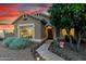This single-story home has a charming front entryway and a low-maintenance yard and walkway with landscape lighting at 28802 N 45Th St, Cave Creek, AZ 85331