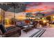Inviting outdoor patio with stylish seating area, fire pit, and sunset views for elegant entertaining at 28802 N 45Th St, Cave Creek, AZ 85331