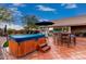 Well-appointed patio area features a hot tub and outdoor kitchen and bar for perfect outdoor gatherings at 28802 N 45Th St, Cave Creek, AZ 85331