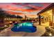 Gorgeous pool with waterfall feature, ambient lighting, and a spacious patio for relaxation and enjoyment at 28802 N 45Th St, Cave Creek, AZ 85331