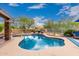 Sparkling pool with a baja step, rock features, and a meticulously landscaped backyard at 28802 N 45Th St, Cave Creek, AZ 85331