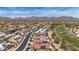 Stunning aerial view of the community, showcasing the desert landscape and mountain views at 301 S 225Th Ave, Buckeye, AZ 85326