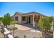 Stunning backyard featuring a covered patio, decorative plants, and desert landscaping at 301 S 225Th Ave, Buckeye, AZ 85326
