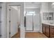 Bathroom featuring shower with glass doors, single vanity, and tile flooring at 301 S 225Th Ave, Buckeye, AZ 85326
