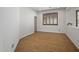 Bedroom with wood floors, neutral walls and plantation shutters at 301 S 225Th Ave, Buckeye, AZ 85326