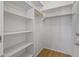 Walk-in closet with shelves and a hanging rod, offering ample storage space at 301 S 225Th Ave, Buckeye, AZ 85326