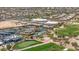 Aerial view of the community showcasing the pool, tennis courts, and recreation facilities at 301 S 225Th Ave, Buckeye, AZ 85326