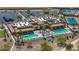 Aerial view of community center with pools, seating, and a meticulously landscaped exterior at 301 S 225Th Ave, Buckeye, AZ 85326