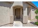 Inviting front entrance featuring a covered porch and decorative details at 301 S 225Th Ave, Buckeye, AZ 85326