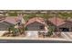 Charming home with a tile roof, desert landscaping, and a two-car garage at 301 S 225Th Ave, Buckeye, AZ 85326