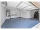 Spacious garage features epoxy flooring, storage cabinets, and room for multiple vehicles at 301 S 225Th Ave, Buckeye, AZ 85326