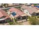 Aerial view of house with tile roof, solar panels, desert landscaping, and a covered patio at 301 S 225Th Ave, Buckeye, AZ 85326