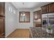 Bright kitchen featuring an island with granite countertop, wooden cabinets, and stainless steel refrigerator at 301 S 225Th Ave, Buckeye, AZ 85326