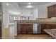 Stylish kitchen with an open layout, granite counters and stainless appliances at 301 S 225Th Ave, Buckeye, AZ 85326