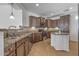 Spacious kitchen featuring granite countertops, stainless steel appliances, and an island at 301 S 225Th Ave, Buckeye, AZ 85326