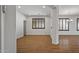 Open living area with wood floors, neutral walls, and bright windows at 301 S 225Th Ave, Buckeye, AZ 85326