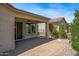 Relaxing covered patio overlooking the yard, a perfect place for outdoor entertaining at 301 S 225Th Ave, Buckeye, AZ 85326