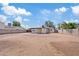 Large, sunny backyard with a covered patio, ready for your landscaping and recreational dreams at 311 N Henkel --, Mesa, AZ 85201