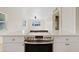 Updated kitchen showcasing modern stainless steel appliances and white countertops, offering an efficient cooking area at 311 N Henkel --, Mesa, AZ 85201