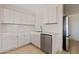 Well-equipped kitchen featuring stainless steel appliances and bright white cabinets, ensuring efficiency and style at 311 N Henkel --, Mesa, AZ 85201