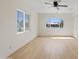 Bright living room with hardwood floors, ceiling fan, and windows that provide plenty of natural light at 311 N Henkel --, Mesa, AZ 85201