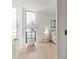 Hallway leading into a light-filled bedroom with large windows and modern decor at 312 E Windsor Ave # 3, Phoenix, AZ 85004