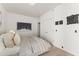 Bedroom featuring neutral tones, modern decor, and sleek, double-door closet at 312 E Windsor Ave # 3, Phoenix, AZ 85004