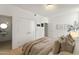 Bedroom showing the closet, doorway to a bathroom, and a large window at 312 E Windsor Ave # 3, Phoenix, AZ 85004