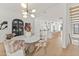 Bright dining room features a modern chandelier and seamless transition to the kitchen and staircase at 312 E Windsor Ave # 3, Phoenix, AZ 85004