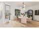 Bright dining area with a modern light fixture, and elegant decor at 312 E Windsor Ave # 3, Phoenix, AZ 85004