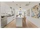 Modern kitchen with stainless steel appliances, island with seating and an open design leading to the living area at 312 E Windsor Ave # 3, Phoenix, AZ 85004
