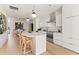 Bright kitchen features stainless steel appliances, island seating and contemporary lighting fixtures at 312 E Windsor Ave # 3, Phoenix, AZ 85004