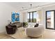 Modern living room boasts stylish seating, contemporary lighting, and large windows for ample natural light at 312 E Windsor Ave # 3, Phoenix, AZ 85004