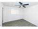 Cozy bedroom with contemporary ceiling fan and light filtering horizontal blinds at 3128 N 40Th Ave, Phoenix, AZ 85019