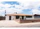 This is a single-story home with a side door and a driveway at 3128 N 40Th Ave, Phoenix, AZ 85019