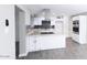 Bright, updated kitchen with gray backsplash, stainless appliances, and a granite countertop island at 3128 N 40Th Ave, Phoenix, AZ 85019