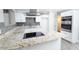 Modern, updated kitchen featuring gray backsplash, stainless appliances, and granite countertops at 3128 N 40Th Ave, Phoenix, AZ 85019