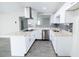 Well-lit kitchen showcasing stainless steel appliances, a gray subway tile backsplash, and granite countertops at 3128 N 40Th Ave, Phoenix, AZ 85019