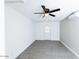 Bright living room features wood-style tile flooring and modern ceiling fan at 3128 N 40Th Ave, Phoenix, AZ 85019
