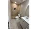 Updated bathroom featuring a walk-in shower with decorative tile and a modern vanity with bright countertop at 3314 W Del Monico Ln, Phoenix, AZ 85051