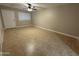 A cozy living room featuring tile flooring, neutral colors, and ample natural light at 3314 W Del Monico Ln, Phoenix, AZ 85051