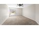 Bright, carpeted bedroom with neutral walls and natural light from a window at 332 N Cobblestone St, Gilbert, AZ 85234