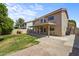 View of the home's exterior, backyard, and covered patio at 332 N Cobblestone St, Gilbert, AZ 85234