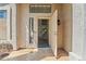 Bright foyer showcasing modern tile flooring, staircase, and an open doorway at 332 N Cobblestone St, Gilbert, AZ 85234