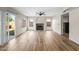 Bright, open living room with wood-look tile flooring, fireplace, sliding glass doors and windows at 332 N Cobblestone St, Gilbert, AZ 85234