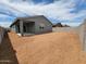 View of the home's backyard featuring a covered patio and ample space for outdoor entertaining and recreation at 3582 E Audrey Dr, San Tan Valley, AZ 85143
