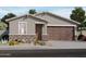 Charming single-story home featuring stone accents, a two-car garage, and desert landscaping for curb appeal at 3582 E Audrey Dr, San Tan Valley, AZ 85143