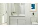 Bright bathroom with modern vanity, toilet, shower, and clean white finishes at 36570 W Maddaloni Ave, Maricopa, AZ 85138